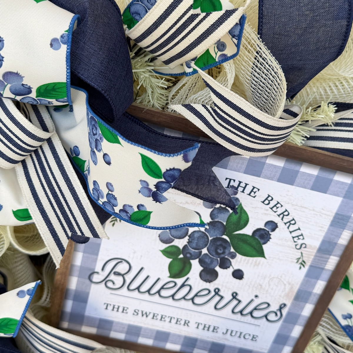 Blueberry Summer Cottage Wreath featuring blueberry-print ribbons, navy and cream accents, decorative bows, and a blueberry sign for front door decor.