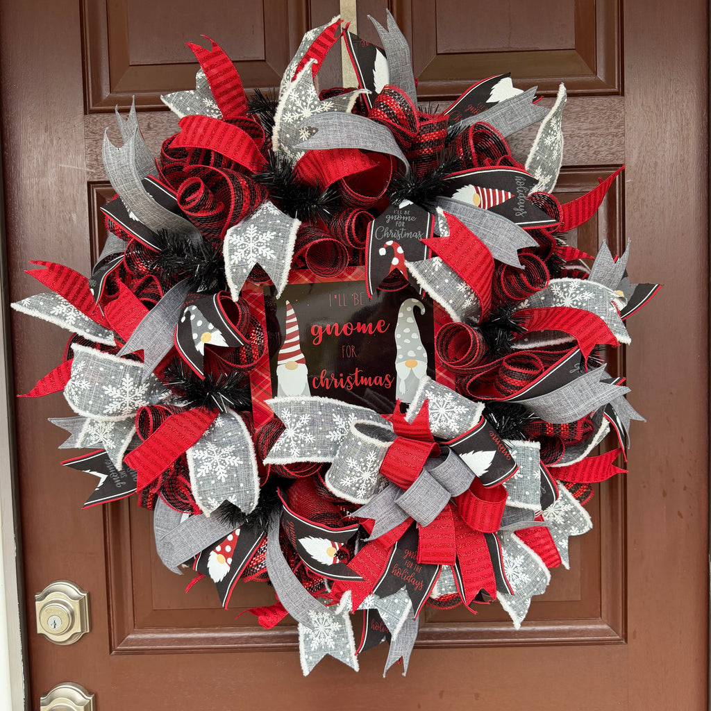 Handmade Christmas gnome deco mesh wreath with red, black, and gray snowflake ribbons and I'll Be Gnome for Christmas sign.