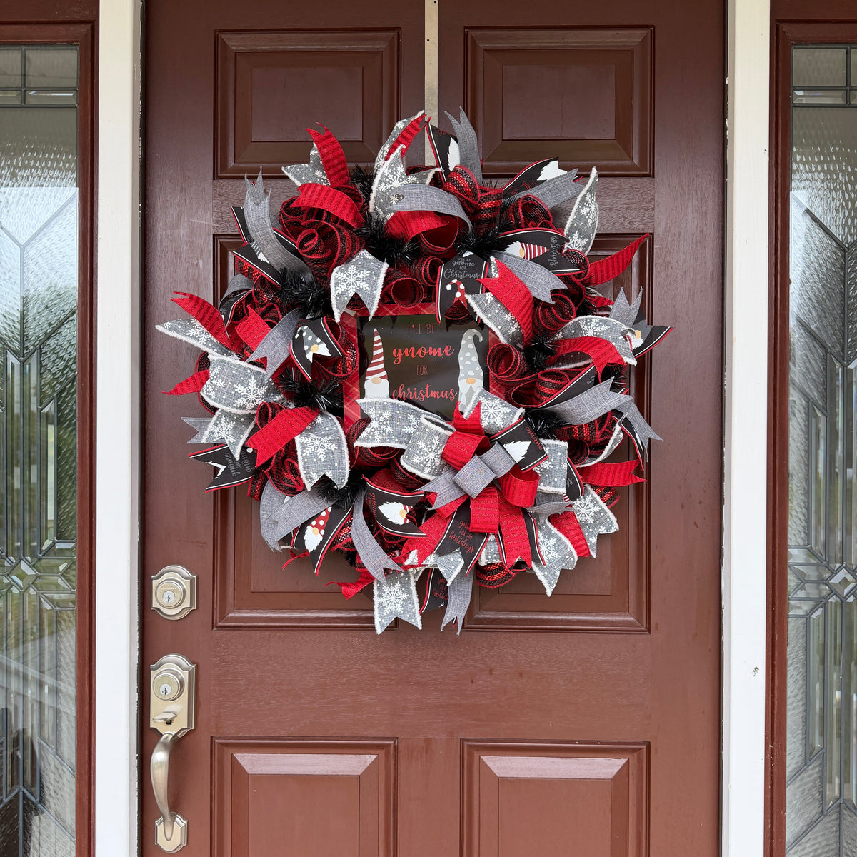 Handmade Christmas gnome deco mesh wreath with red, black, and gray snowflake ribbons and I'll Be Gnome for Christmas sign.