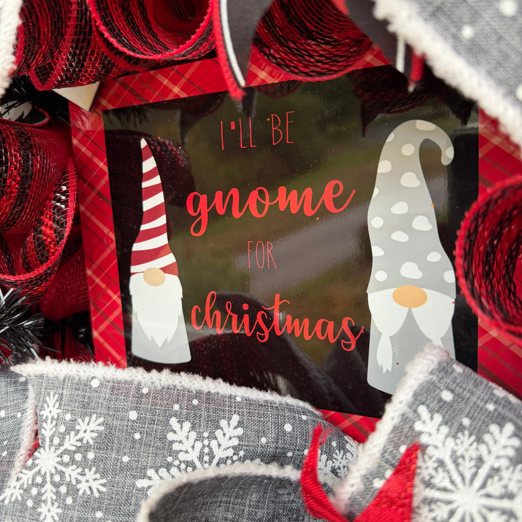 Handmade Christmas gnome deco mesh wreath with red, black, and gray snowflake ribbons and I'll Be Gnome for Christmas sign.