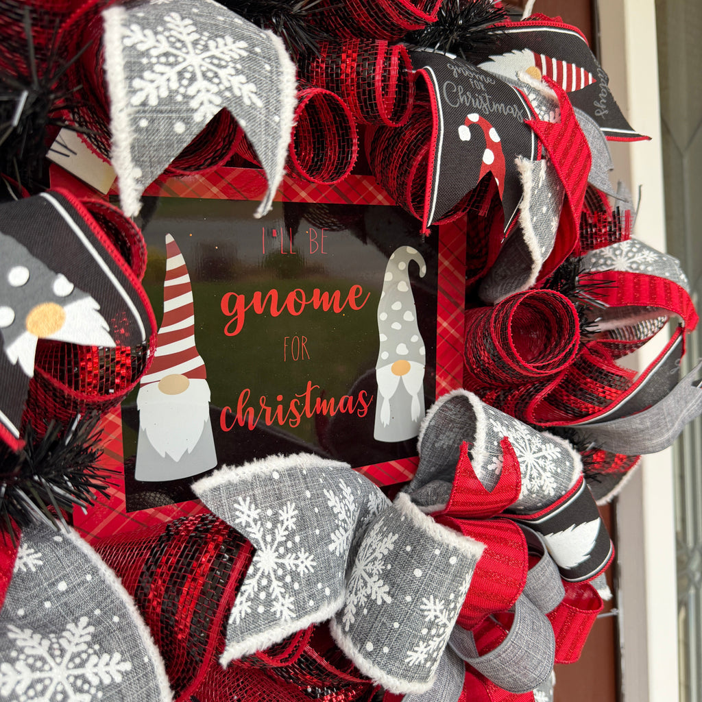 Handmade Christmas gnome deco mesh wreath with red, black, and gray snowflake ribbons and I'll Be Gnome for Christmas sign.