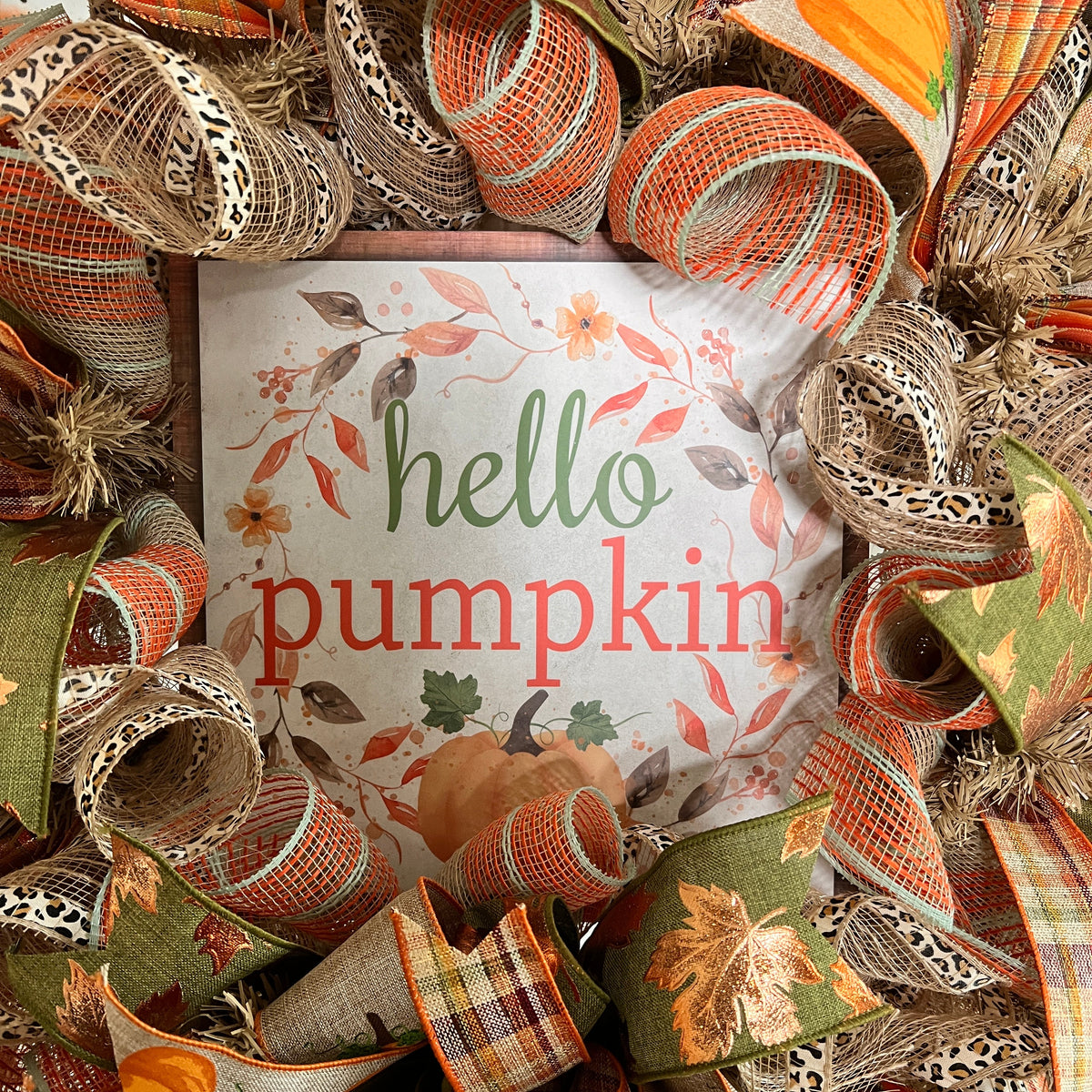 Hello Pumpkin fall wreath with orange, green, plaid, and pumpkin ribbons.