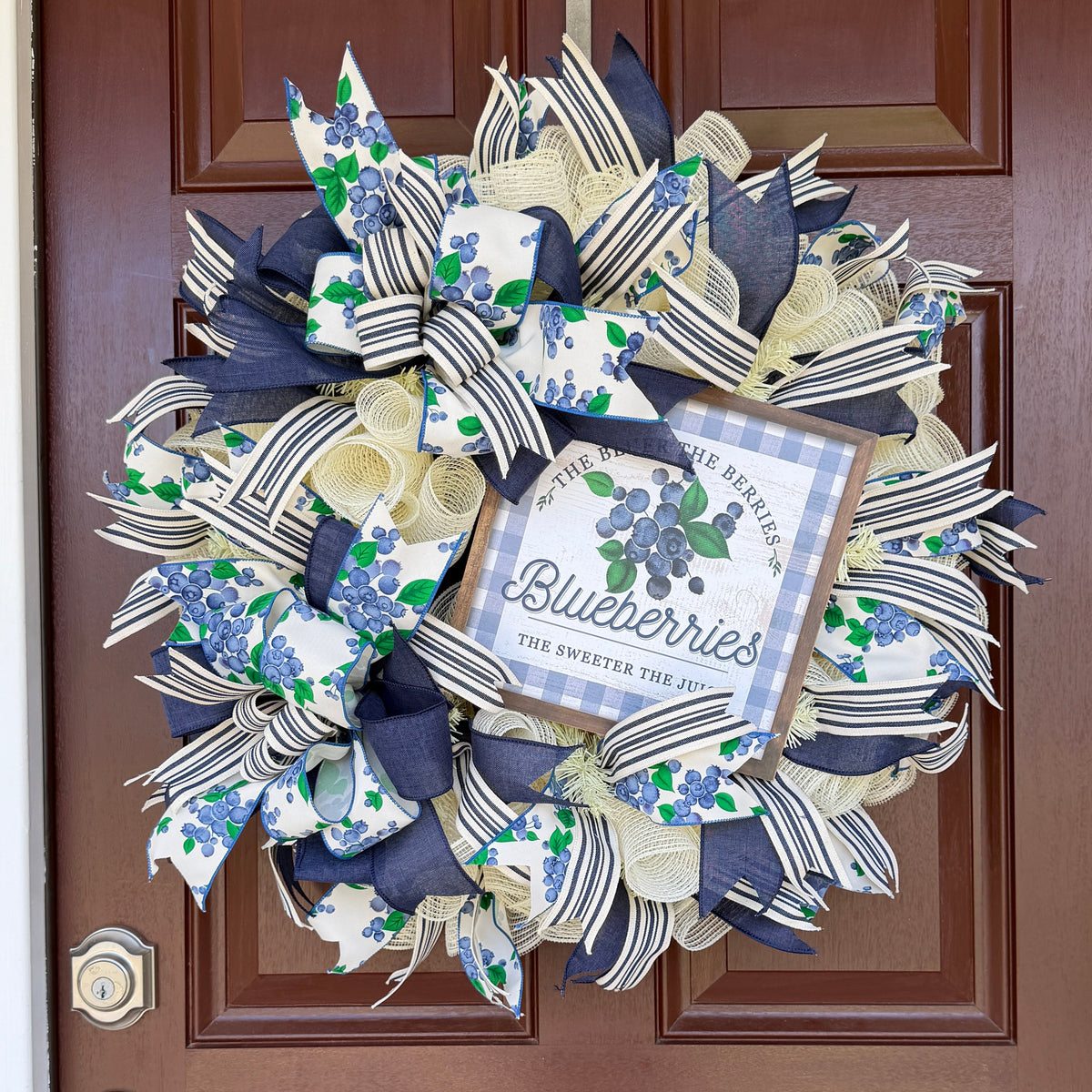 Blueberry Summer Cottage Wreath featuring blueberry-print ribbons, navy and cream accents, decorative bows, and a blueberry sign for front door decor.