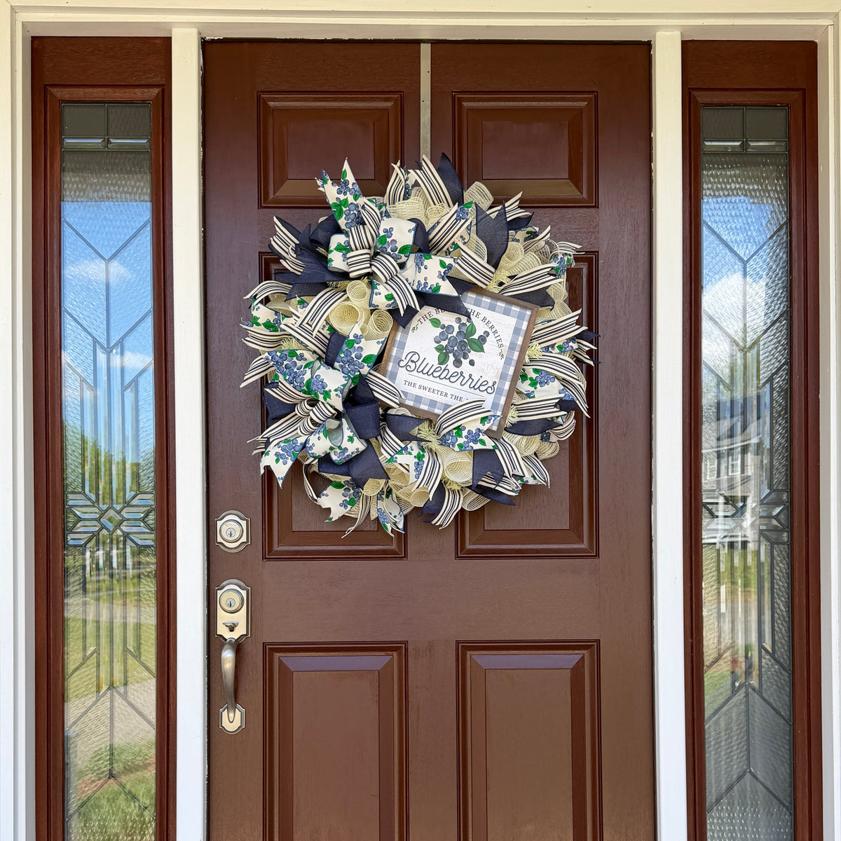 Blueberry Summer Cottage Wreath featuring blueberry-print ribbons, navy and cream accents, decorative bows, and a blueberry sign for front door decor.