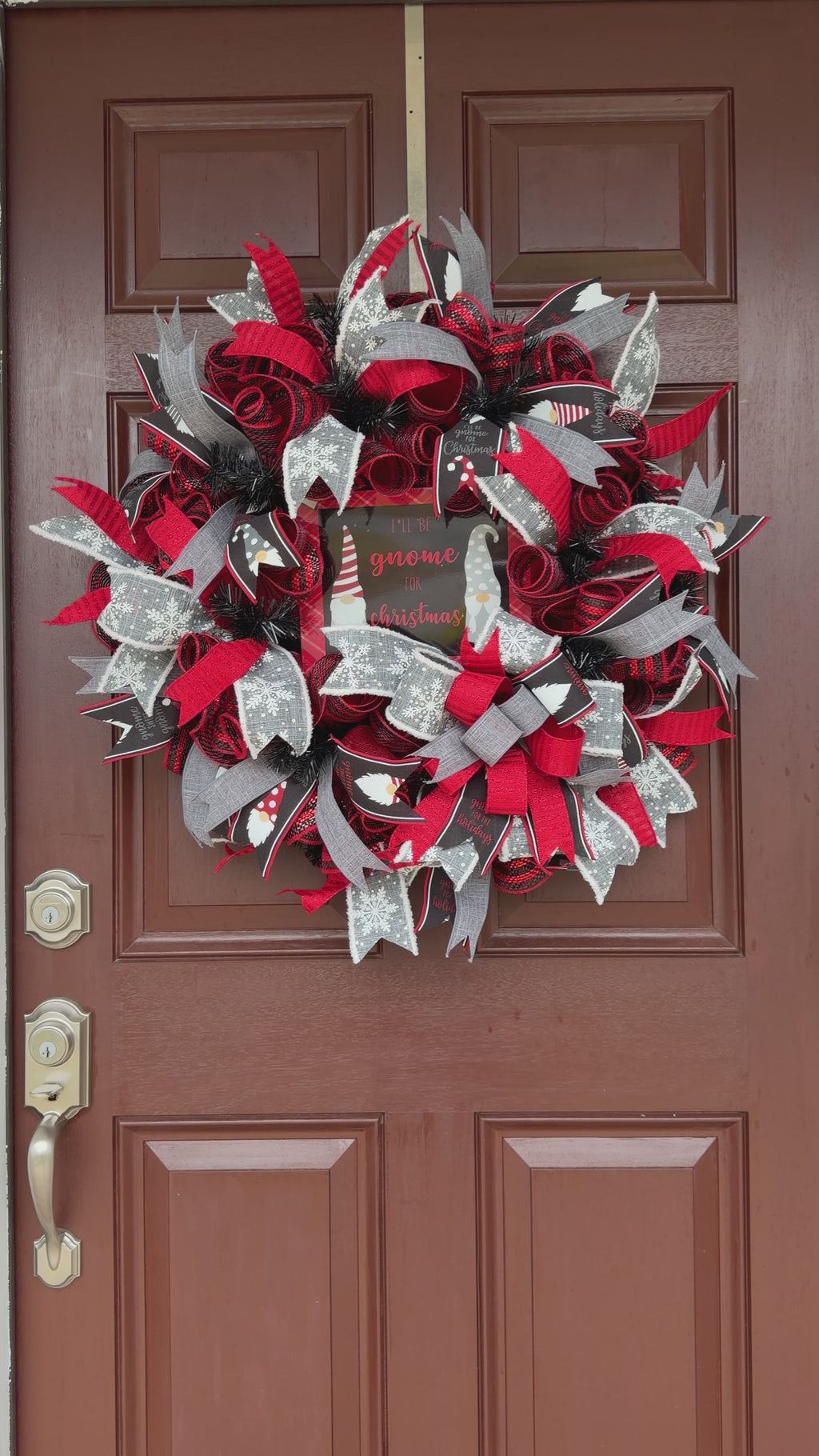 Handmade Christmas gnome deco mesh wreath with red, black, and gray snowflake ribbons and I'll Be Gnome for Christmas sign.