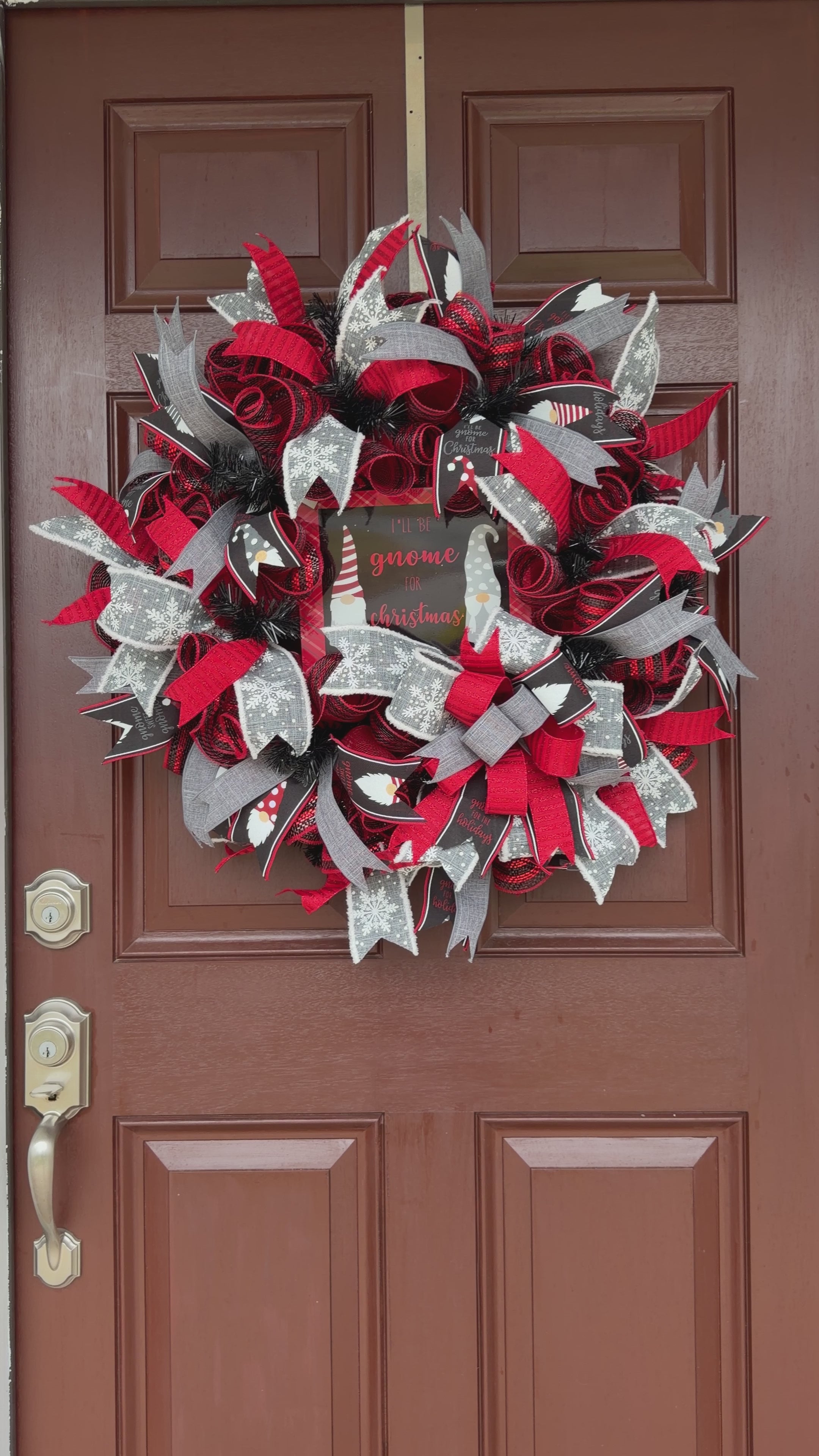 Handmade Christmas gnome deco mesh wreath with red, black, and gray snowflake ribbons and I'll Be Gnome for Christmas sign.
